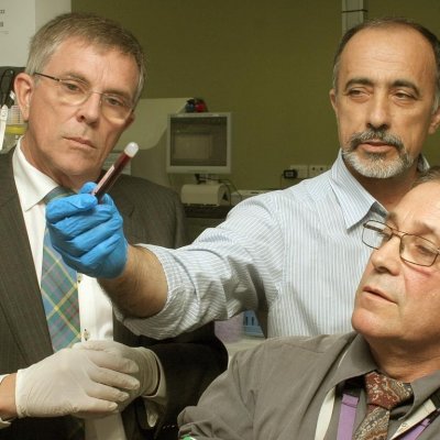 Queensland Minister Ian Walker, left, Dr Goce Dimeski and Dr Paul Masci.